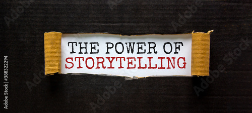 Photography The words 'the power of storytelling' appearing behind torn black paper