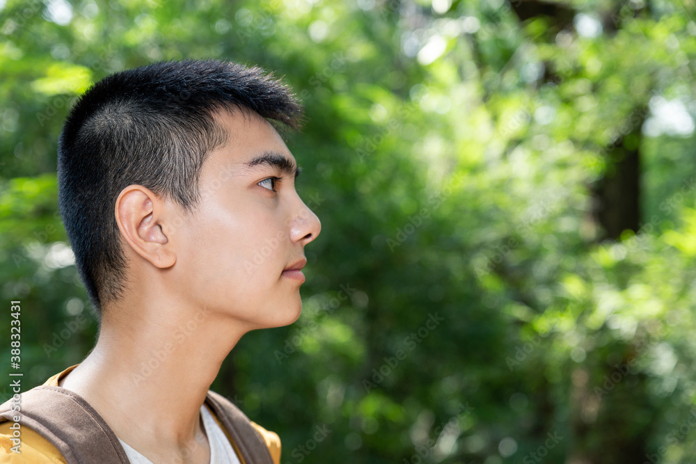Asian teenager breathing hike through forest to peak of mountain. Asian teenager breathing hike through forest to peak of mountain.