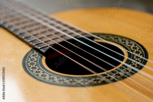 classic spanish guitar on wooden background. guitar with nylon strings