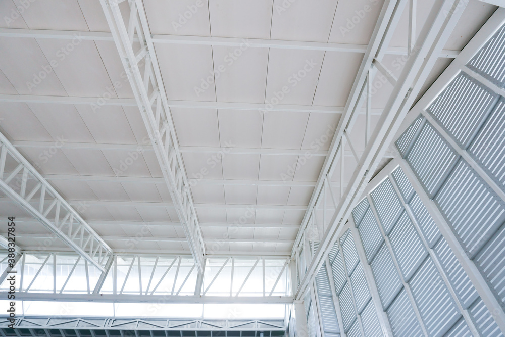 Large steel structure truss, roof frame and metal sheet in building construction site