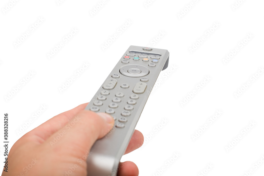 TV silver remote control in hand isolated closeup. TV silver remote control in hand isolated closeup.