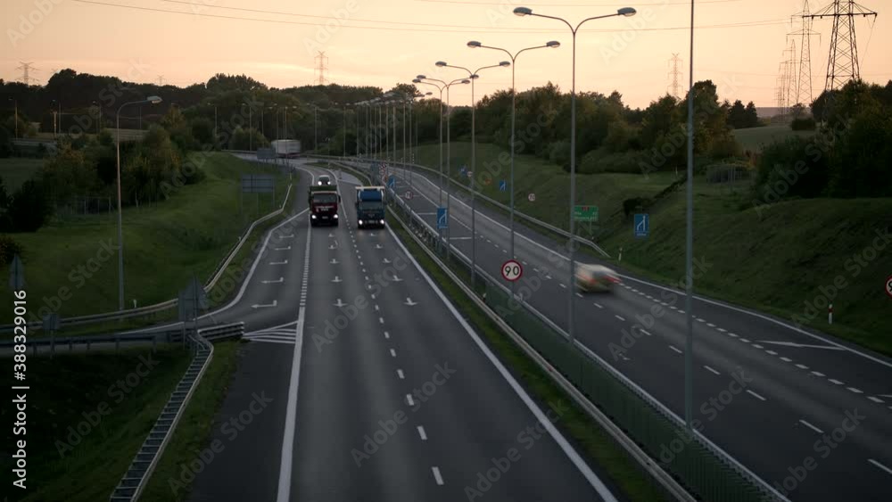 Time-lapse Still Shot Of A Four-Lane Road With Cars During Sunset Time-lapse Still Shot Of A Four-Lane Road With Cars During Sunset