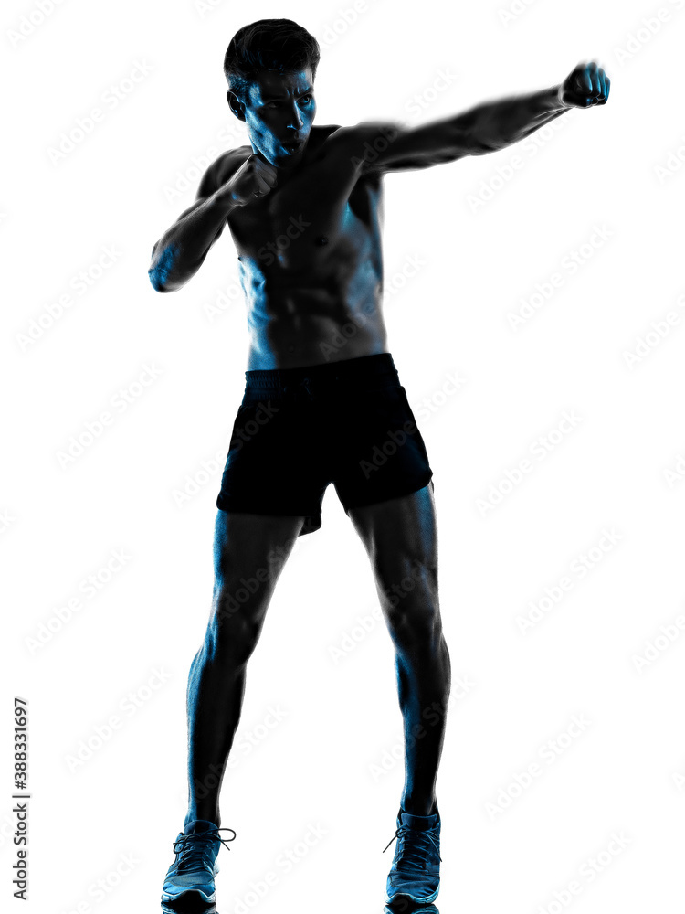 one caucasian young man exercIsing fitness exercise in studio shadow silhouette isolated on white background one caucasian young man exercIsing fitness exercise in studio shadow silhouette isolated on white background