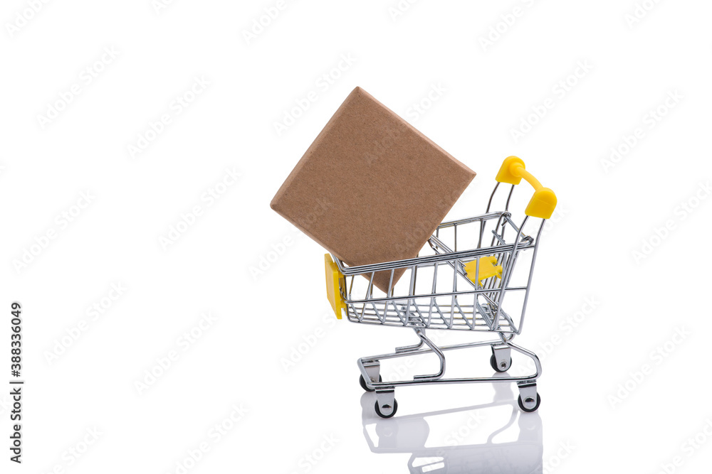 Paper box in a shopping cart isolated on white background.