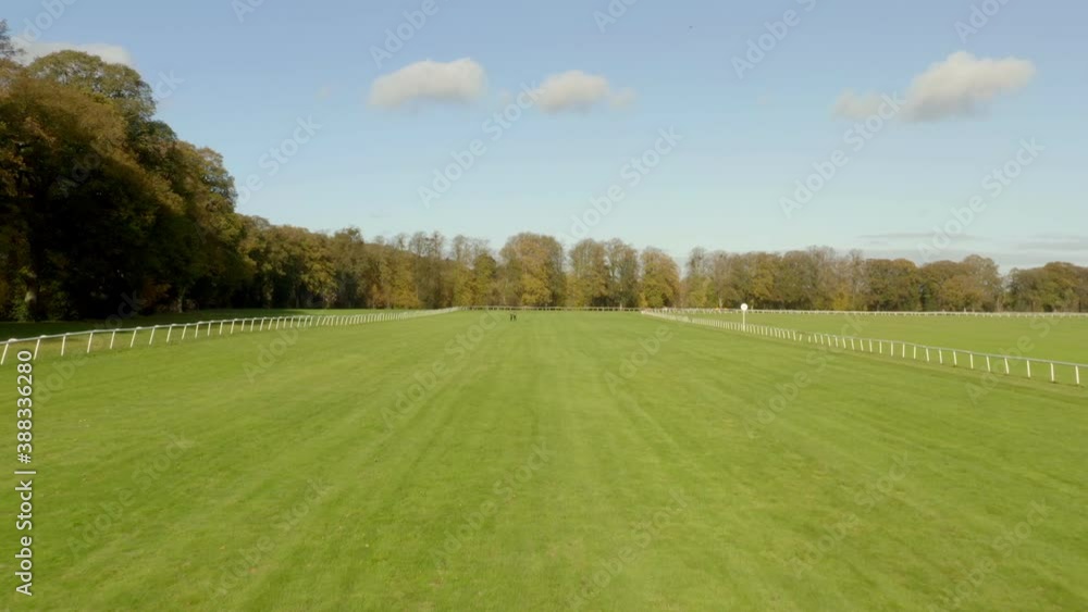 Low fly along race course towards people Low fly along race course towards people