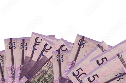 50 Dominican pesos bills lies on bottom side of screen isolated on white background with copy space. Background banner template photo