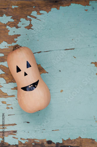 Halloween pumpkin on shabby wooden background. Concept of Thanksgiving day, Halloween.