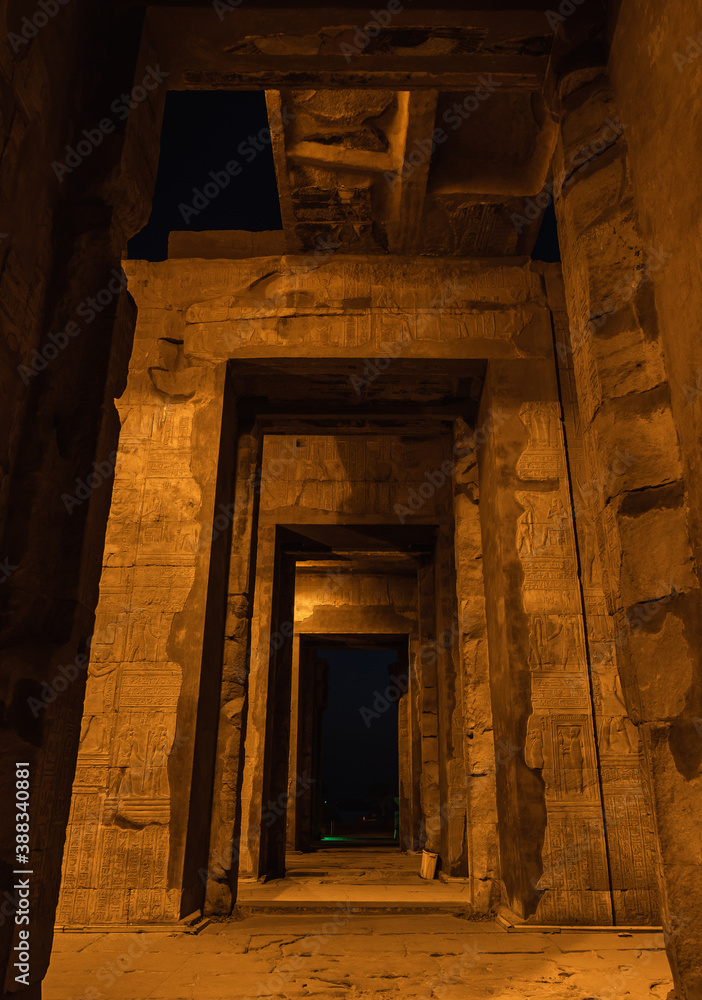Beautiful columns of the Kom Ombo temple at night illuminated, the temple dedicated to the gods Sobek and Horus. Town of Kom Ombo near Aswer, Egypt Beautiful columns of the Kom Ombo temple at night illuminated, the temple dedicated to the gods Sobek and Horus. Town of Kom Ombo near Aswer, Egypt