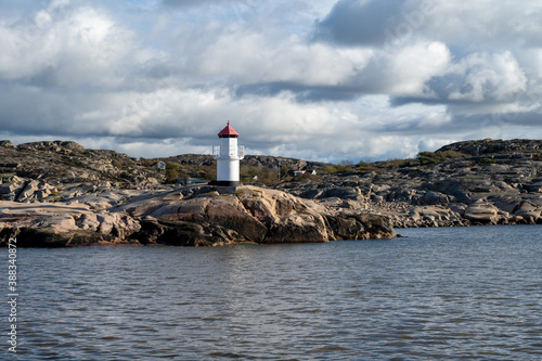 A beautiful lighthouse outside a fishing village on the Swedish Atlantic coast. Picture from Hamburgsund, Vastra Gotaland, Sweden