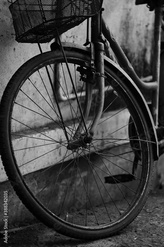 Old Bicycle wheel in the village of Vengurla. India. Maharashtra state. Taken on October 26, 2020