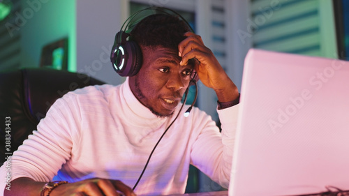 Tableau sur toile Portrait shot of disappointed young black man professional game player losing in video game