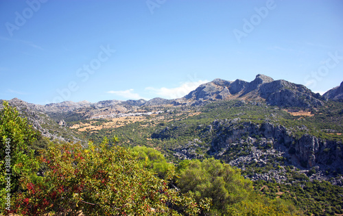 Landscape of the Sierra de Grazalema Natural Park with the white village of Benaocaz in background, Cadiz province Andalusia Spain
