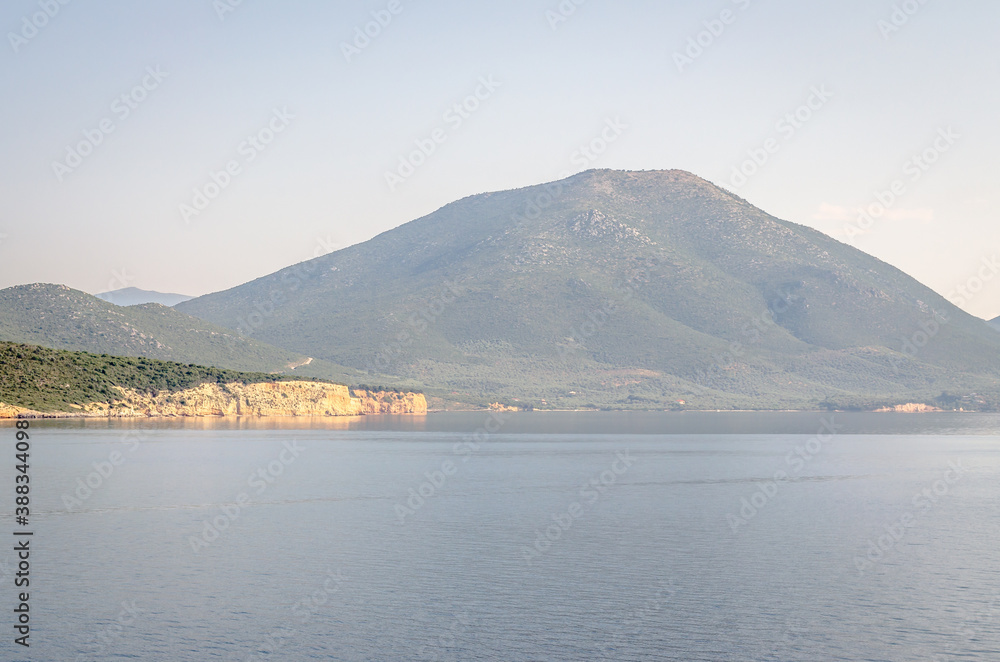Evia island, Greece - June 28. 2020: Panorama of the Greek island of Evia from the ferry 