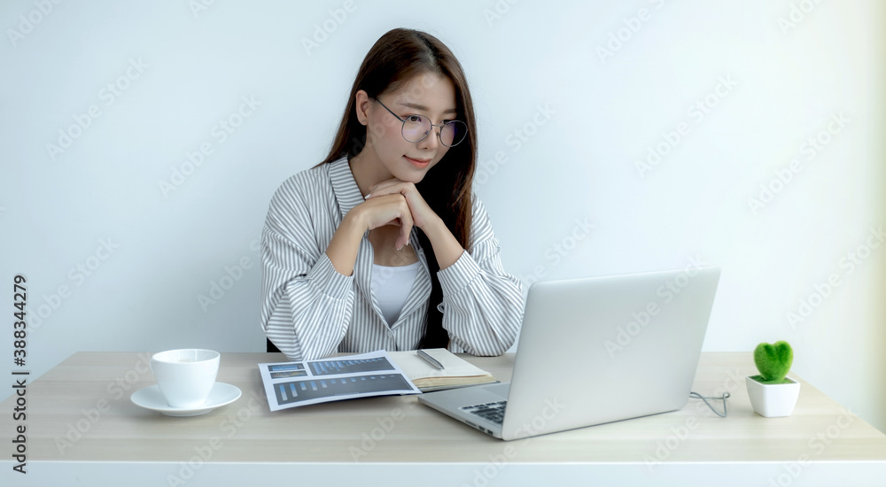 Young Asian teachers are teaching fun online from their home office, social distancing teaching concept during COVID virus diseases Young Asian teachers are teaching fun online from their home office, social distancing teaching concept during COVID virus diseases
