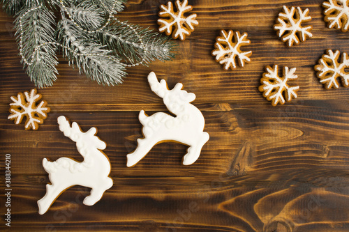 Christmas composition with gingerbread on the wooden background with copy space