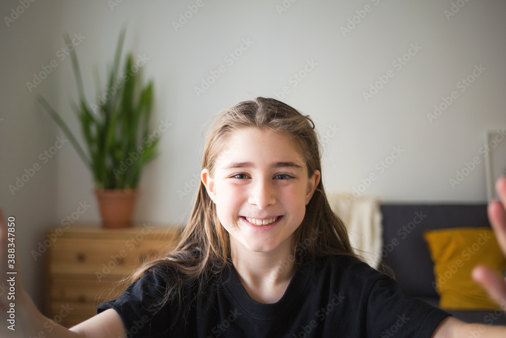 girl looks at camera and smiles. student talks over Internet. Video Conference or e-learning at home girl looks at camera and smiles. student talks over Internet. Video Conference or e-learning at home