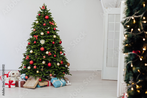 Christmas tree pine with gifts for the new year red decor winter