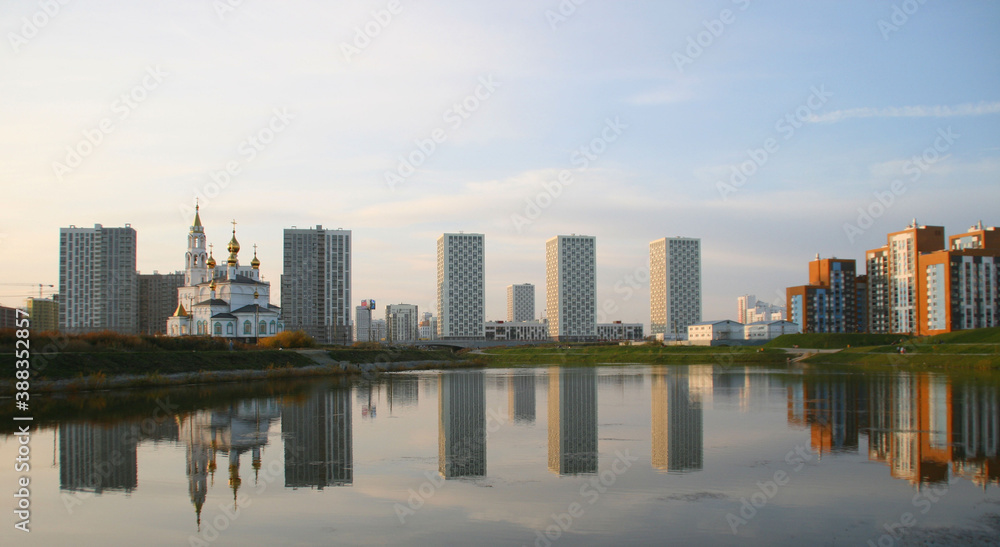 Fototapeta premium Modern residential high-rise buildings in Russia. Real estate background. Real estate market concept. Apartment building. New builded residential building. Banner size