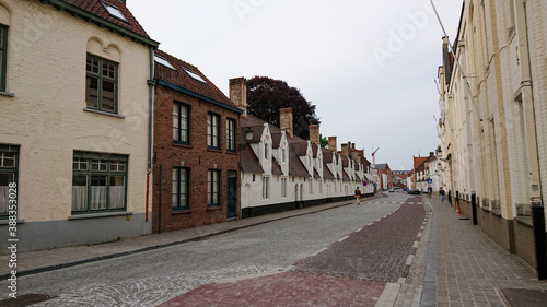 Bruges, Belgium - May 12, 2018: Roofs And Windows Of Old Authentic Brick Houses On Street Vrijdagmarkt