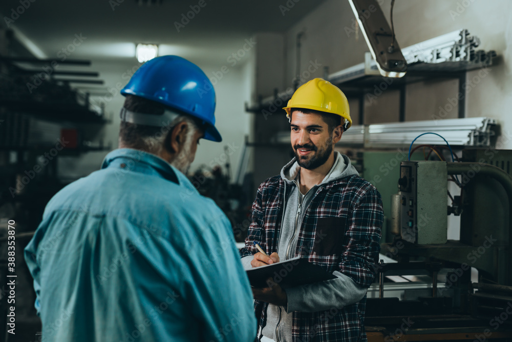Aluminium and PVC industry workers making PVC frames for windows