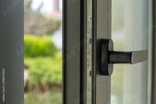 Close up of aluminum door window, blurry background