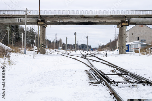 Railway in winter. Snow-covered railway tracks.