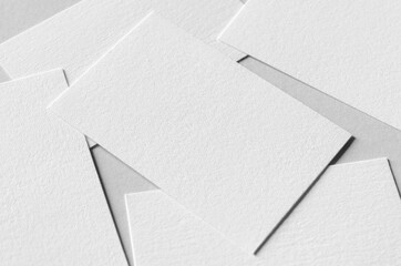 Textured business card mockup on a grey background.  85x55 mm.