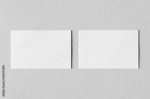 Textured business card mockup on a grey background.  85x55 mm.