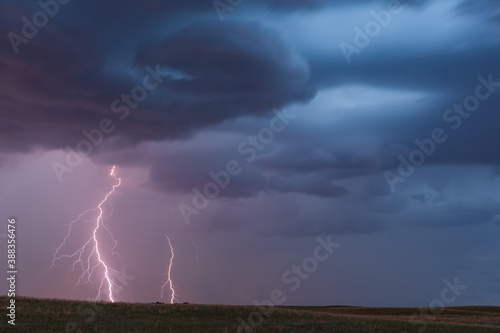 Thunderstorm lightning bolts with storm clouds and dark sky
