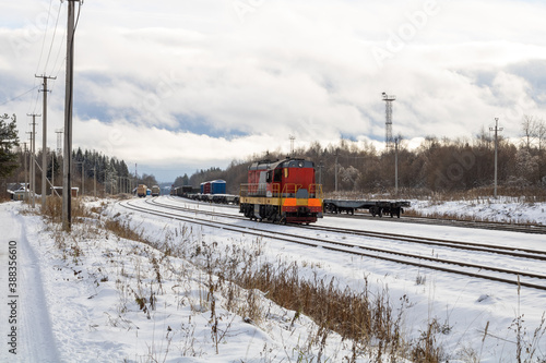 Train in winter. Old diesel locomotive on the railway.