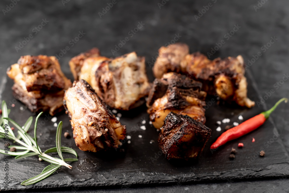 grilled beef ribs on a stone background  with copy space for your text