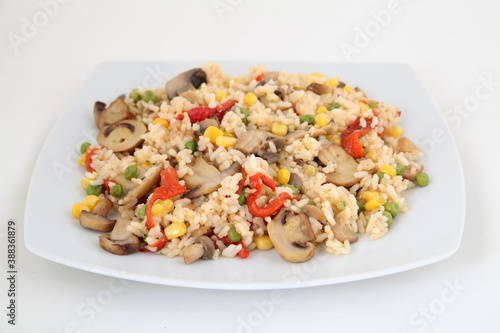 rice with vegetables on white plate
