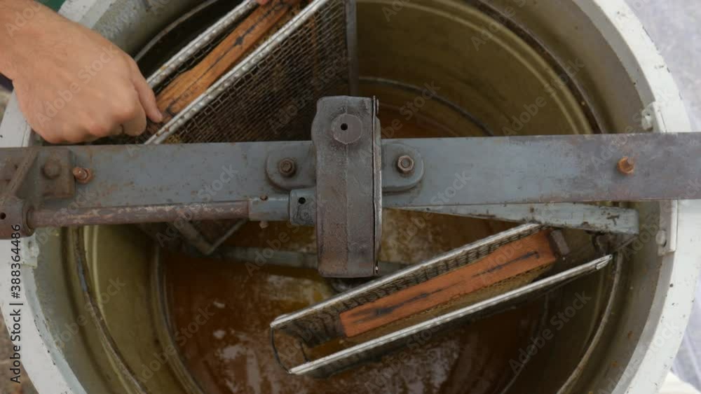 Stockvideon Manual centrifuge device that Spin the Honey from cells
