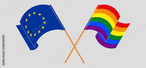 Crossed and waving flags of LGBTQ and the EU