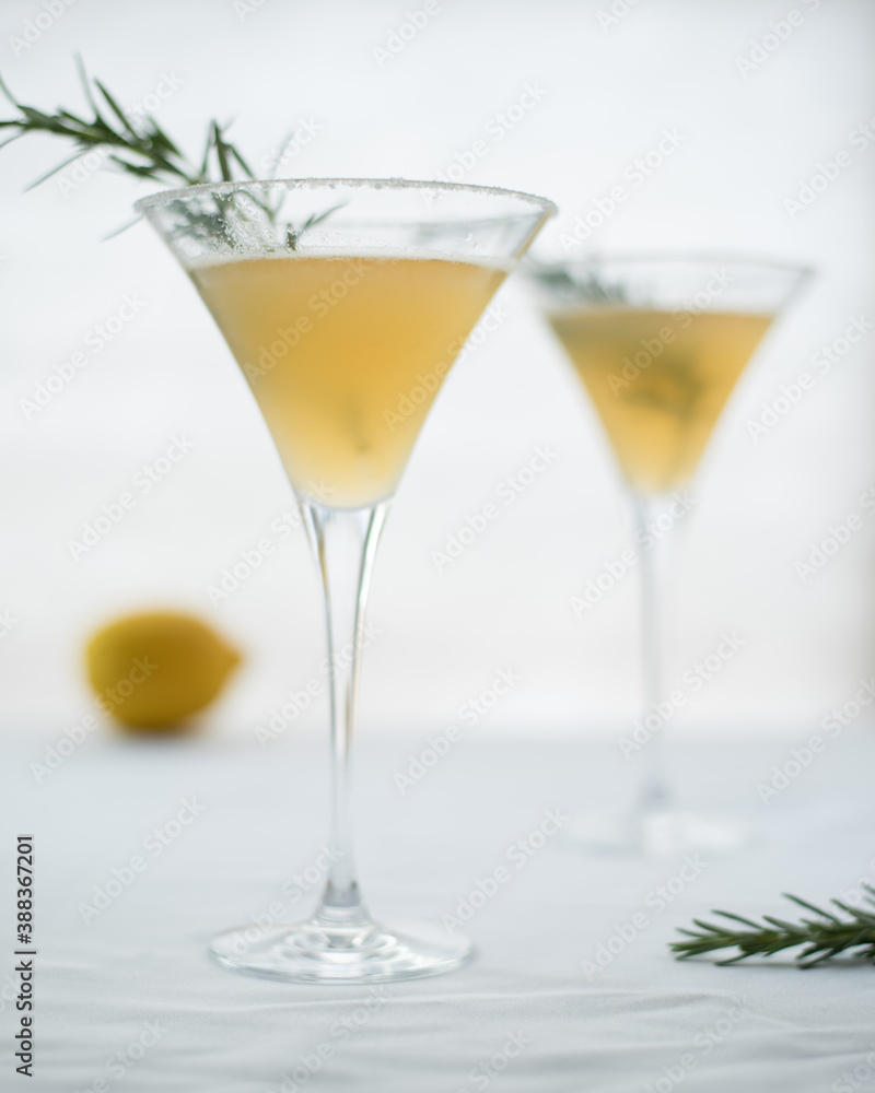Lemon drop martini cocktail with rosemary