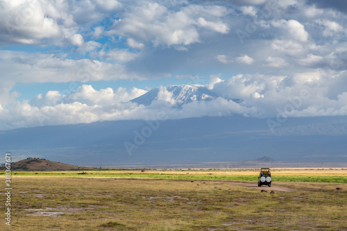 Safari Vehicle on a Road Near Mount Kilimanjaro in Amboseli National Park, Kenya, Africa