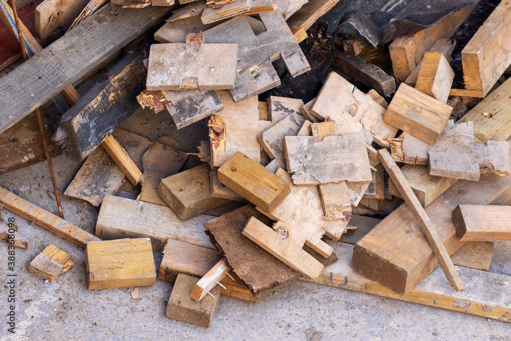 Pile of timber wood off cuts or offcuts on building construction site. Carpentry background
