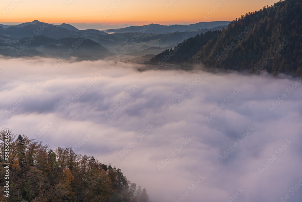 Fototapeta premium Magnificent landscapes of autumn mountains covered with fog, reaching the distant snow-capped peaks of the High Tatras 