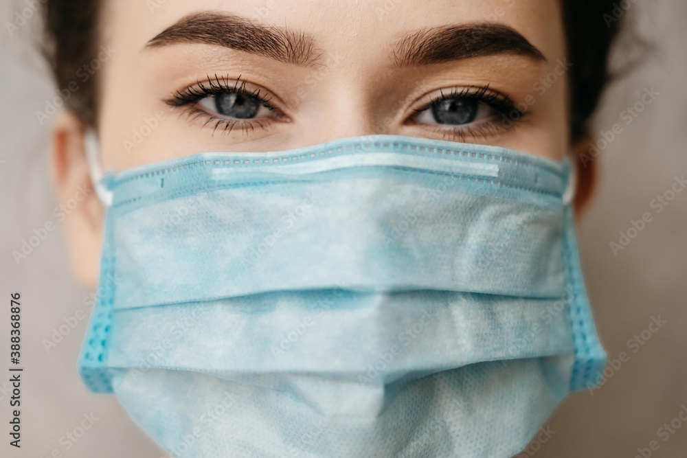 Woman wearing an anti virus protection mask to prevent others from corona COVID-19 and SARS cov 2 infection Woman wearing an anti virus protection mask to prevent others from corona COVID-19 and SARS cov 2 infection