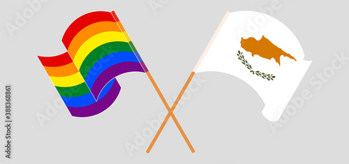 Crossed and waving flags of LGBTQ and Cyprus