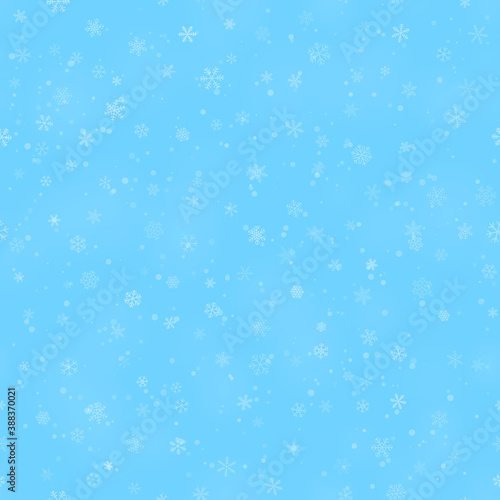 Christmas seamless pattern of snowflakes of different shapes, sizes and transparency, on light blue background