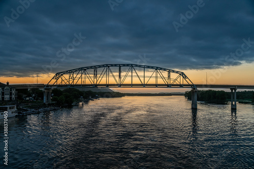The Wabasha Nelson Bridge Over the Mississippi River at Sunset on a Cloudy Day, As Seen From a Riverboat