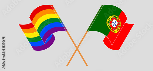 Crossed and waving flags of Portugal and LGBTQ