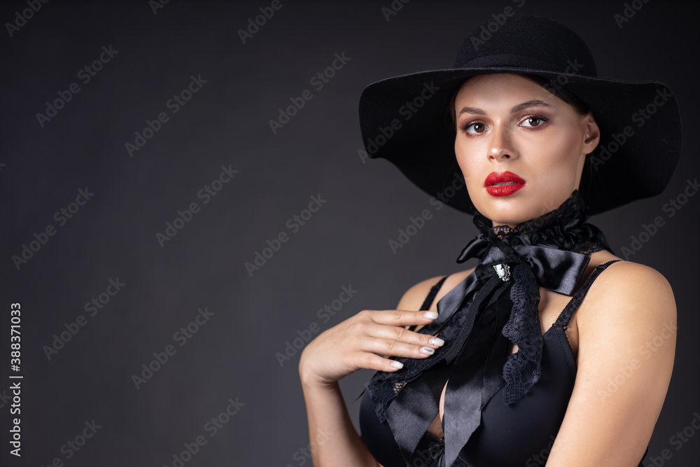 Beautiful woman in hat. Retro fashion. Dark Background. Beautiful woman in hat. Retro fashion. Dark Background.