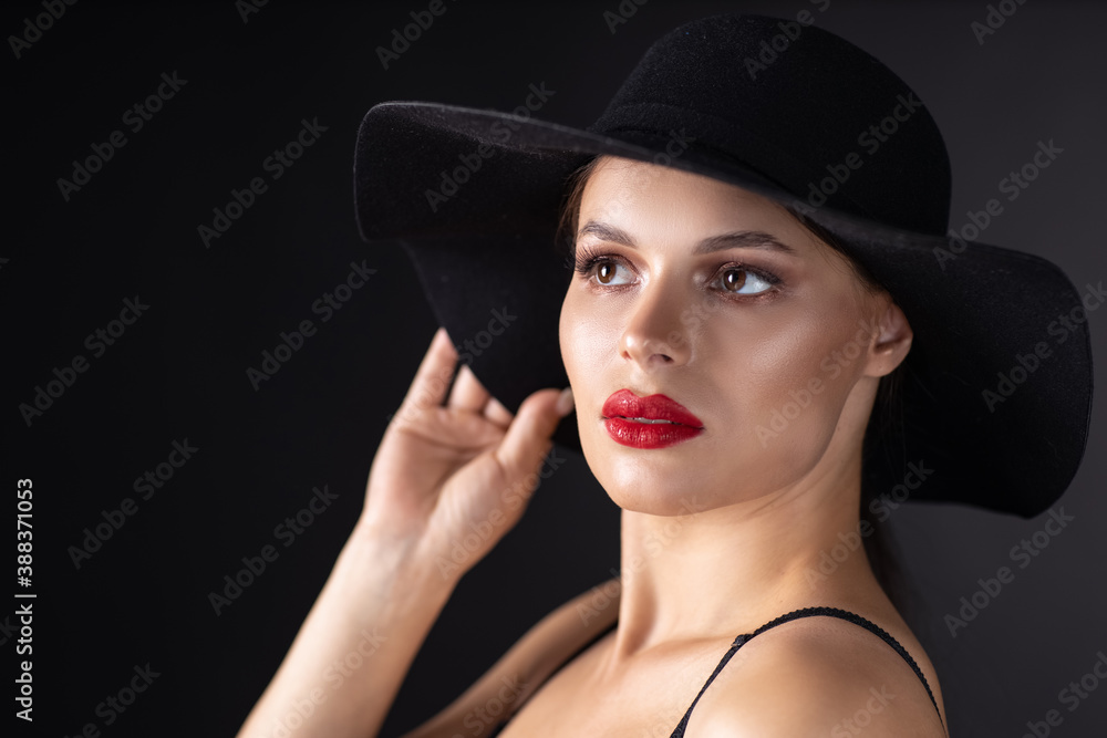 Beautiful woman in hat. Retro fashion. Dark Background. Beautiful woman in hat. Retro fashion. Dark Background.
