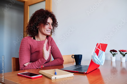 woman at home doing a videoconference - stay home concept