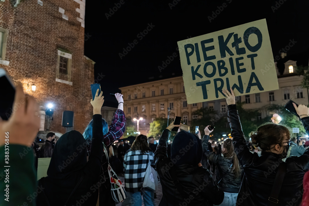 Krakow, Poland - October 24, 2020: Polish women on nationwide protest for fundamental rights against new almost complete ban on abortion. The banner translates ' hell for women continues '