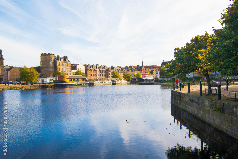 Obraz premium A viw of The Shore area of Leith, Edinburgh, UK, as seen from the west end of the old Victoria swing bridge.