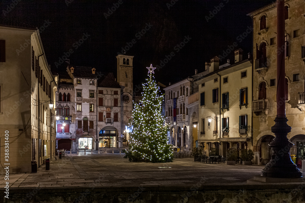  View on Christmas tree in medieval town square, Vittorio Veneto, Italy. Concept: Italian historic centers, urban panoramas, urban Christmas decorations