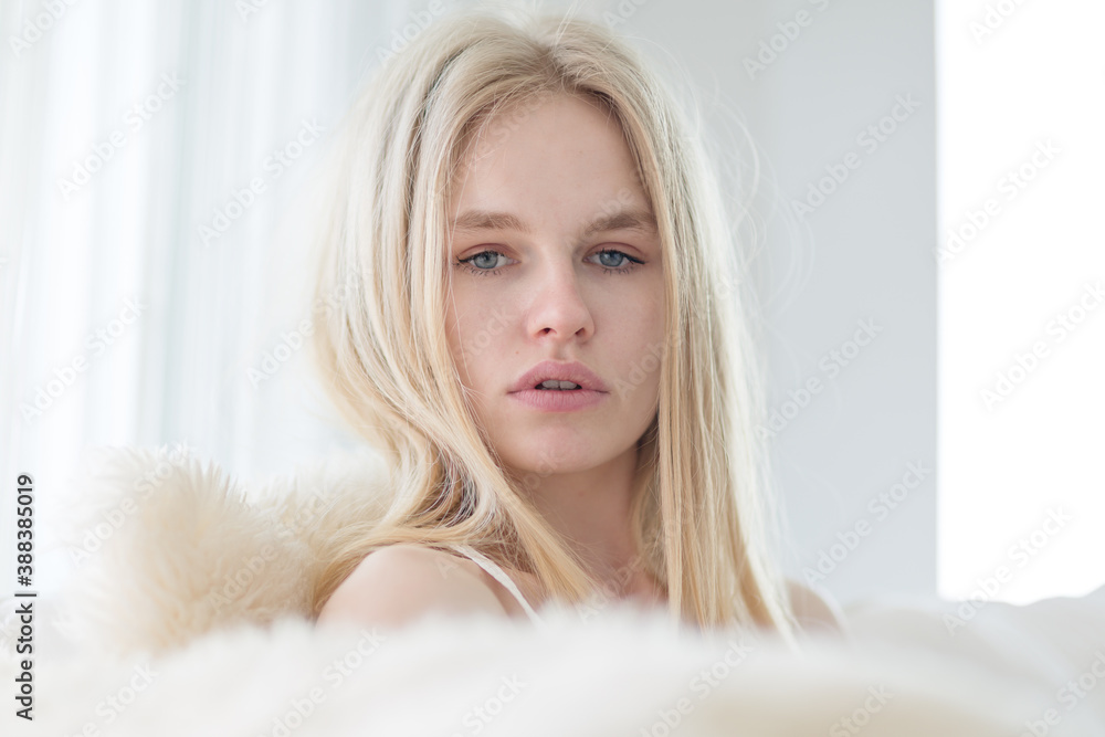 Portrait of beautiful blonde woman looking at the camera. Portrait of beautiful blonde woman looking at the camera.